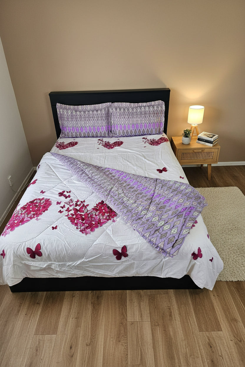 Bed with butterfly-patterned bedding and pillows in a room setting.